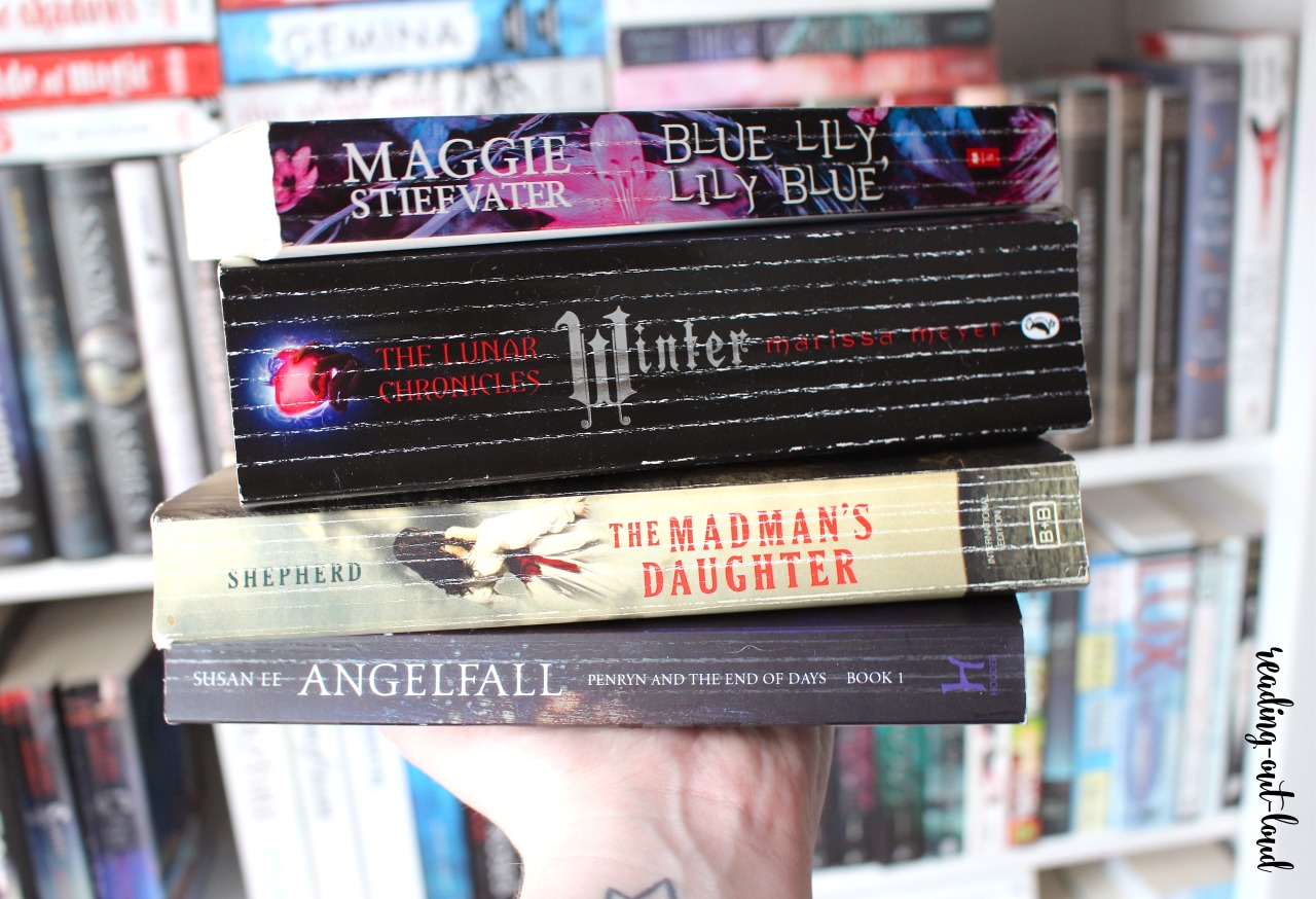 Stack of books all with severely cracked book spines